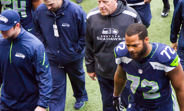 Michael Bennett with Seahawks staff