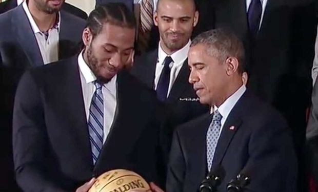 Kawhi_Leonard_presents_ball_to_President_Obama