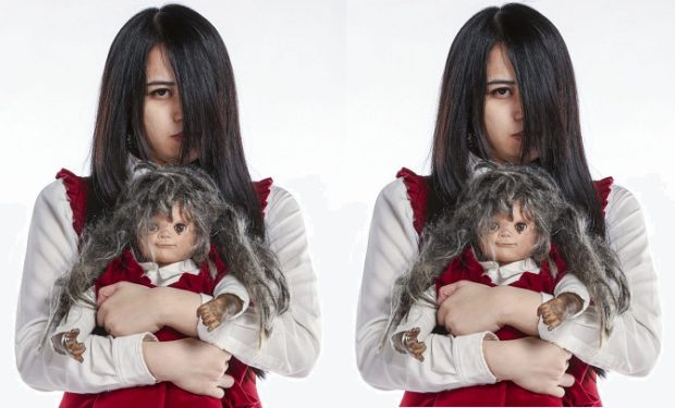 creepy girl with black hair and doll