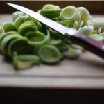 Knife cutting knife on cutting board