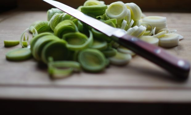 Knife cutting knife on cutting board