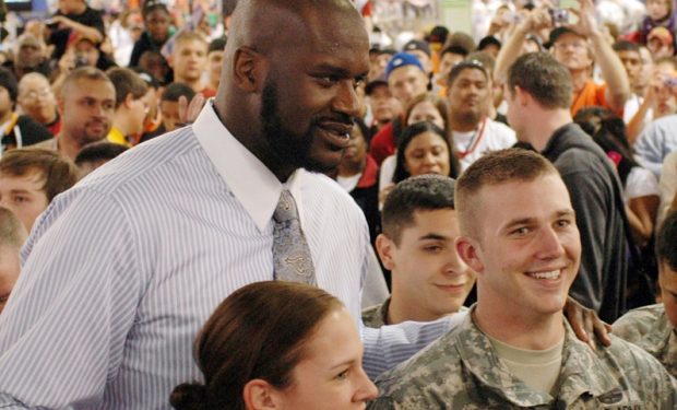 Army National Guard members Staff Sgt. Maygen Matson, left, and Spc. Taylor Anonson pose for a photo with National Basketball Association superstar Shaquille O'Neal during NBA All-Star Weekend in Phoenix, Feb. 15, 2009. U.S. Air Force photo by Tech. Sgt. Angela Walz