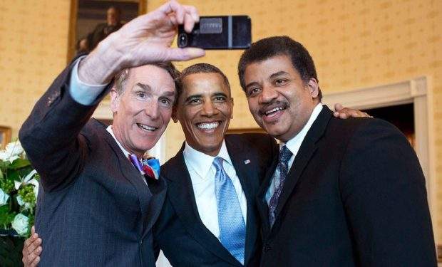 President Barack Obama poses for a selfie with Bill Nye, left, and Neil DeGrasse Tyson in the Blue Room prior to the White House Student Film Festival, Feb. 28, 2014. (Official White House Photo by Pete Souza) This official White House photograph is being made available only for publication by news organizations and/or for personal use printing by the subject(s) of the photograph. The photograph may not be manipulated in any way and may not be used in commercial or political materials, advertisements, emails, products, promotions that in any way suggests approval or endorsement of the President, the First Family, or the White House.
